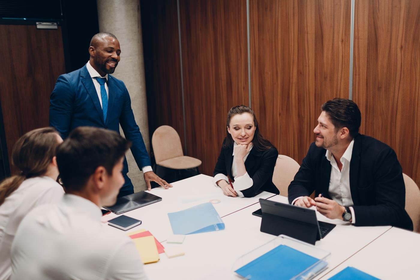 An executive leading a boardroom discussion